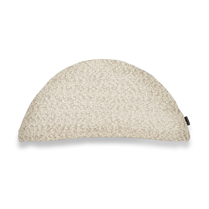 Double sided beige boucle in a half moon shape featuring an exposed brass zip to bottom seam. 