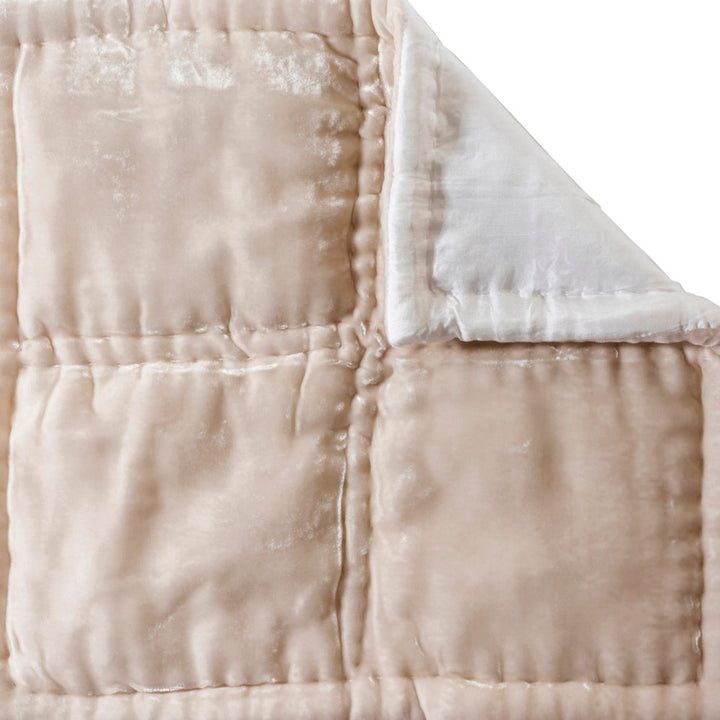 King Size (250cm x 235cm) creamy white bedspread created in a quilted plush silk velvet blend with silk lining.