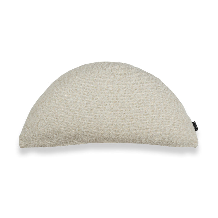 Double sided milk boucle in a half moon shape featuring an exposed brass zip to bottom seam. 