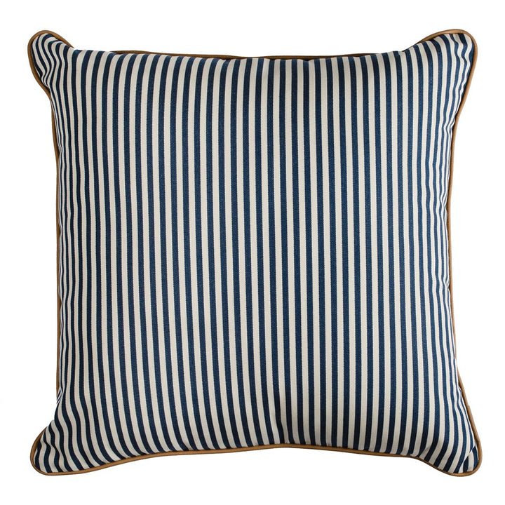 Designer outdoor cushion with a reversible design, navy and white stripe, blue reverse and tan piping.