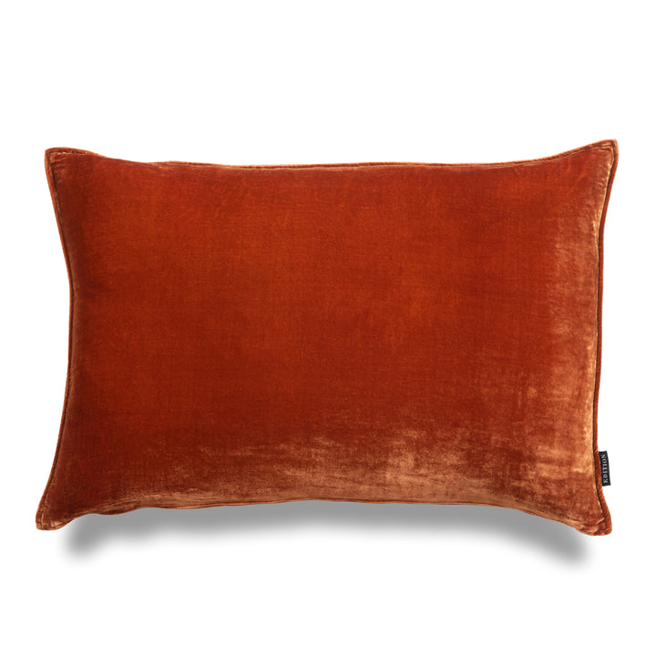 Double sided rust silk velvet with a 5mm closed flange detailing to the seam. 60x40cm rectangular cushion.